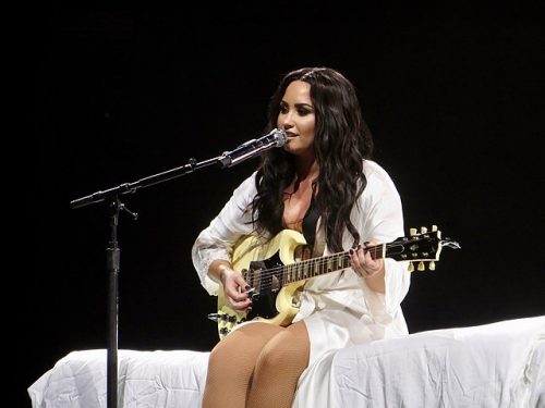 Demi Lovato on guitar.